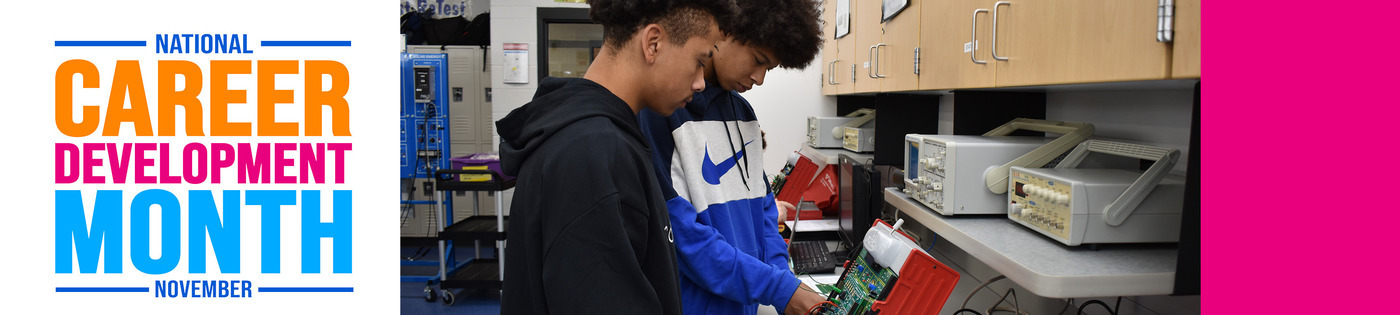 students working on a circuit board