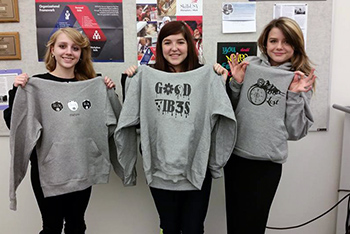 Graphic Production Technologies students with their screen printed hoodies.