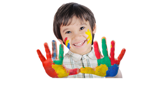 Young boy with paint on hands
